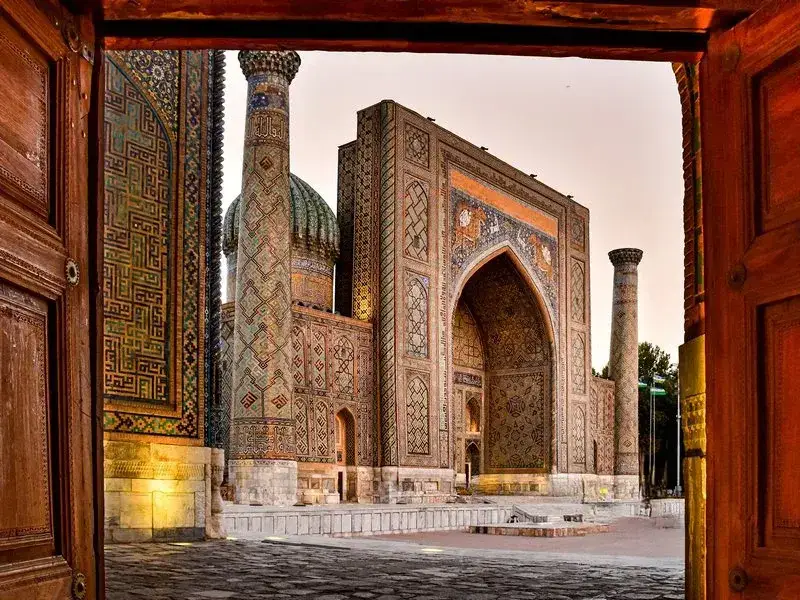 Blue tilework in a madrasa courtyard